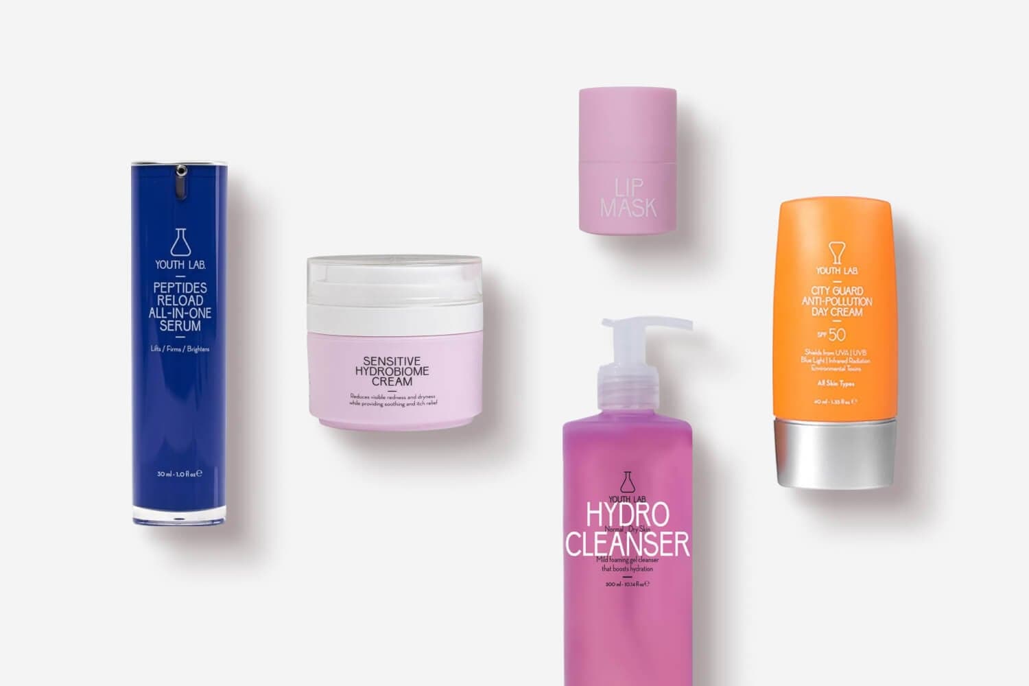 YOUTH LAB Peptides Reload All-in-One Serum, Sensitive Hydrobiome Cream, Lip Mask, Hydro Cleanser and City Guard Anti-Pollution Day Cream SPF 50 on grey.
