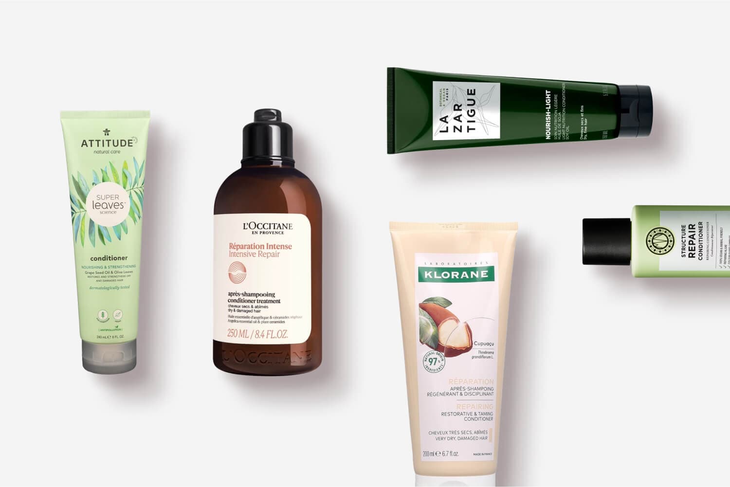 Attitude Super Leaves, L'Occitane Réparation Intense, La Biosthétique Lazartigue Nourish-Light, Klorane Cupuaçu and Structure Repair conditioners on grey