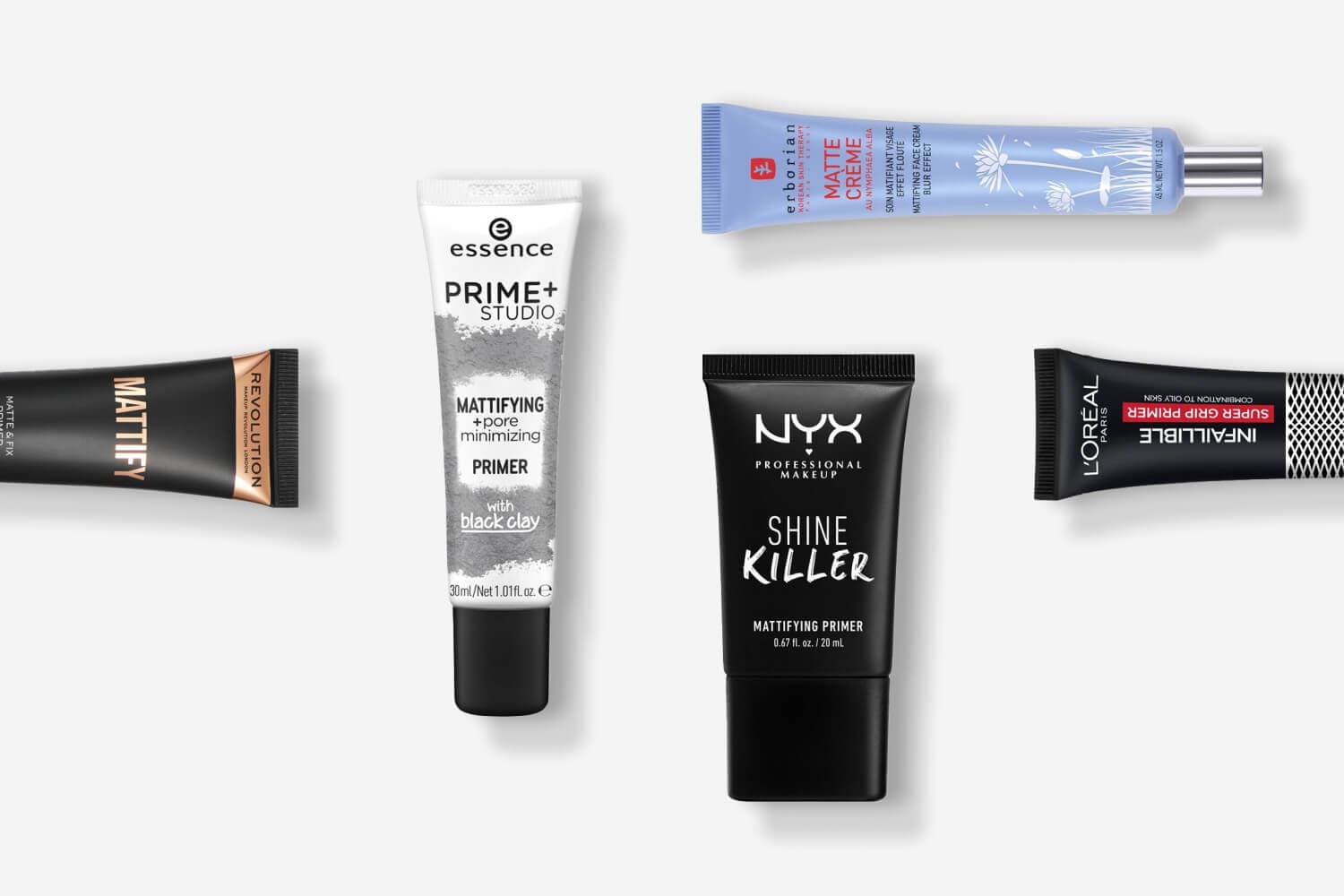 Makeup Revolution Mattify, essence Prime+ Studio, Erborian Matte Crème, NYX Shine Killer and L'Oréal Infaillible Super Grip primer tubes on grey. Makeup Revolution Mattify, essence Prime+ Studio, Erborian Matte Crème, NYX Shine Killer and L'Oréal Infaillible Super Grip primer tubes on grey.