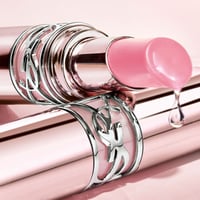 Yves Saint Laurent Loveshine Candy Glow بلسم شفاه ملون للعناية بلمعة شفافة 1B Pink Sunrise 3.1g