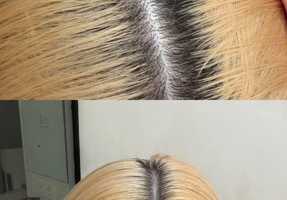 Close-up views of blonde hair with dark roots along a middle part. review