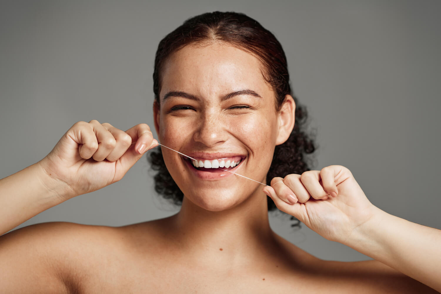 How To Floss Your Teeth: Products & Techniques